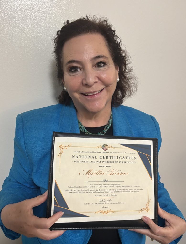 Martha Teissier picture with certificate